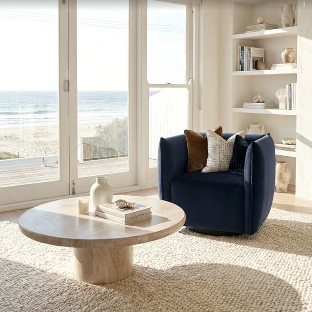 Kanangra indigo velvet swivel armchair in a modern living room