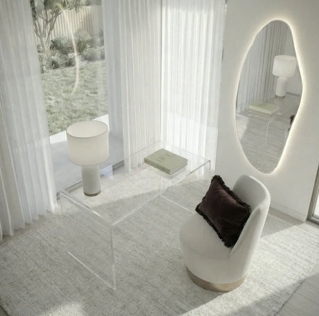Lorne irregular backlit LED wall mirror in a styled bedroom