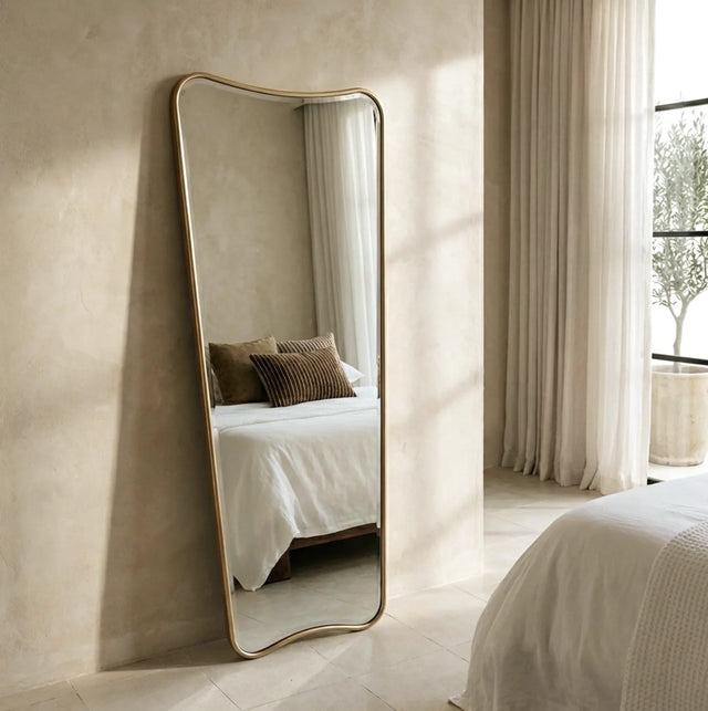 Torquay gold frame full length wall mirror in a bright hallway