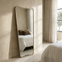 Torquay gold frame full length wall mirror in a bright hallway