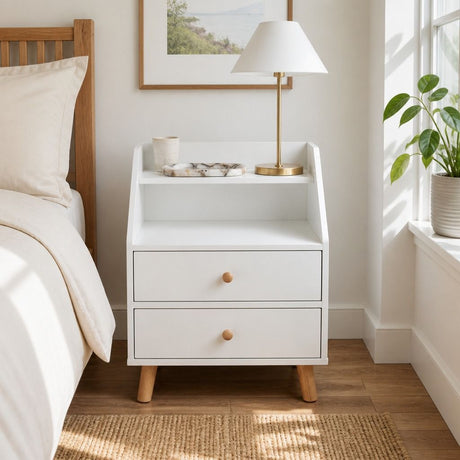 Rosebank warm white two drawer bedside table with wooden legs in a Nordic bedroom