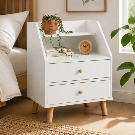 Rosebank warm white two drawer bedside table with wooden legs in a Nordic bedroom