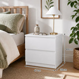Nimbin warm white two drawer bedside table with finger pull drawers in a compact bedroom