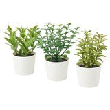 Artificial herb potted plant close-up showing lifelike leaf and stem detail — Allure Home Collections