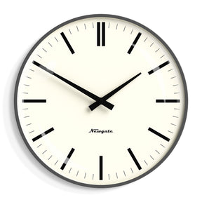 Celeste matte blizzard grey wall clock with bold black marker dial on a living room wall