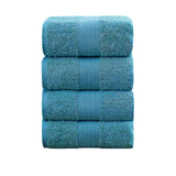 Set of four blue 550 GSM ring spun cotton bath towels folded and stacked