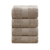 Set of four sandstone 550 GSM ring spun cotton bath towels folded and stacked