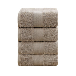 Set of four sandstone 550 GSM ring spun cotton bath towels folded and stacked