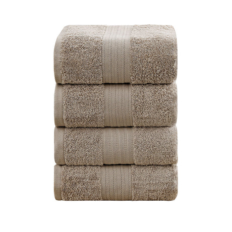 Set of four sandstone 550 GSM ring spun cotton bath towels folded and stacked