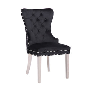 Dingley black velvet bar stools pair with quilted backs and steel legs