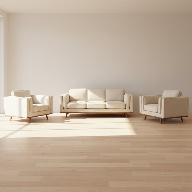 Modern living room with beige sofa set and glass coffee table.