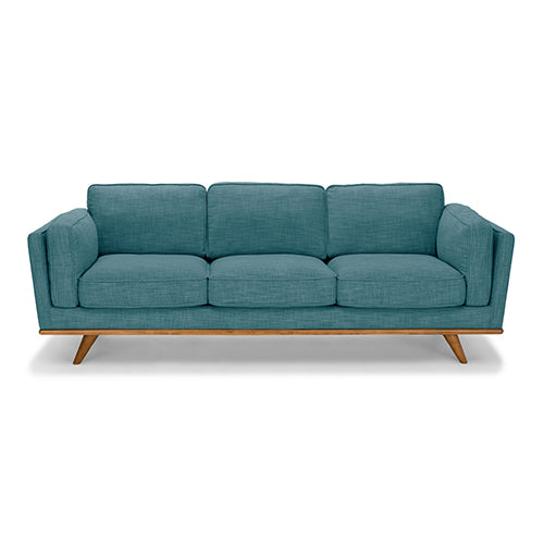 Marbella teal fabric sofa in a modern living room