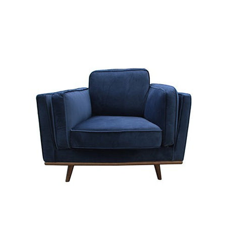 Cascade blue velvet armchair in a modern living room