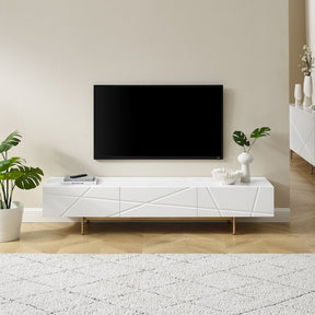 Oatlands gloss white TV cabinet with linear design and gold metal base in a living room