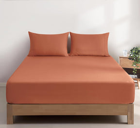 Montalcino beige vintage washed cotton fitted sheet combo set on a bed
