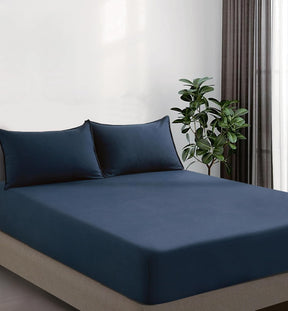 Volterra navy vintage washed microfibre fitted sheet set on a bed