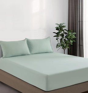 Volterra sage vintage washed microfibre fitted sheet set on a bed