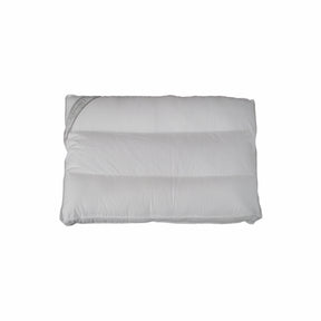 Green Island 3 zone therapeutic adjustable pillow on a bed