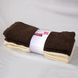 Set of four cotton hand towels in chocolate and cream, folded and stacked