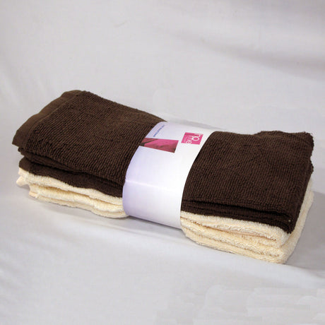 Set of four cotton hand towels in chocolate and cream, folded and stacked