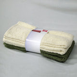 Set of four cotton hand towels in olive and cream, folded and stacked