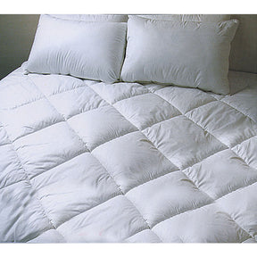 Llangrannog Air Soft fitted mattress underlay king single on a bed