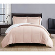 Apricot micro mink comforter with quilted squares and two pillowcases on a Queen bed