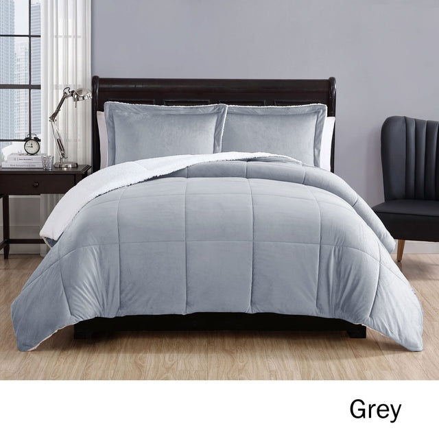 Grey micro mink comforter with quilted squares and two pillowcases on a Queen bed