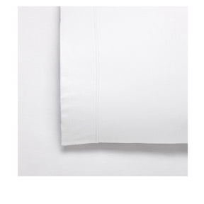 Deruta white 170GSM flannelette fitted sheet sized by dimension on a bed