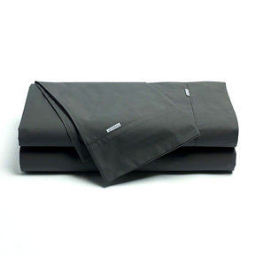 Norcia charcoal 300TC cotton percale sheet set on a bed