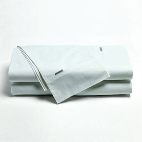 Norcia white 300TC cotton percale sheet set on a bed