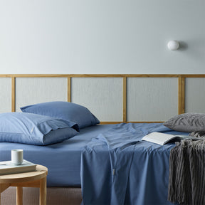 Bevagna blue recycled cotton and bamboo sheet set on a bed