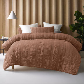 Compton Abdale tobacco seersucker comforter set on a Queen bed with two pillowcases