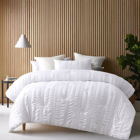 Compton Abdale white seersucker comforter set on a King bed with two pillowcases