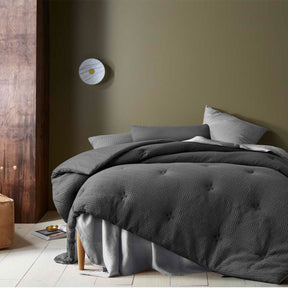 Woodmancote dark grey waffle weave comforter set on a King bed with two pillowcases