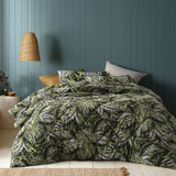 Washed cotton comforter set with a green botanical Styx print and two pillowcases on a queen bed