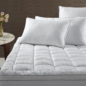 Barmouth deluxe hotel mattress topper in king single with striped cotton cover and piped edges