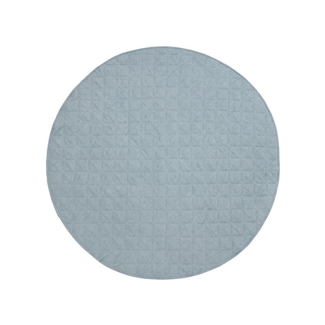 Detail of quilted French linen top on round baby play mat