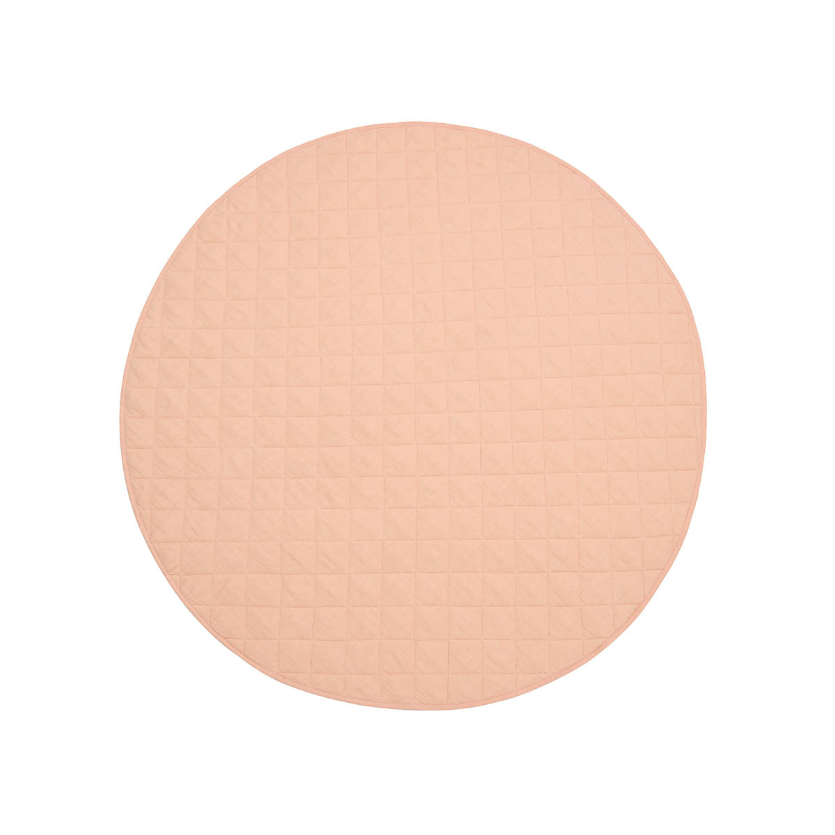 Detail of quilted French linen top on peach round baby play mat