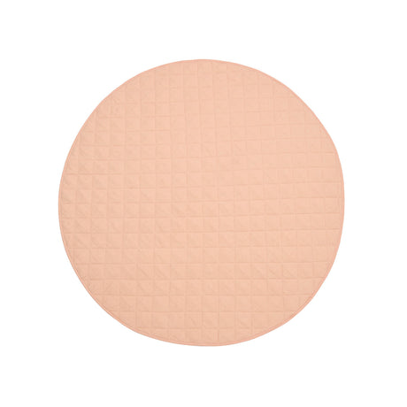 Detail of quilted French linen top on peach round baby play mat
