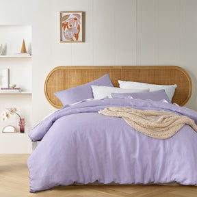 Rivarennes lilac French linen quilt cover set with vintage wash on a styled bed