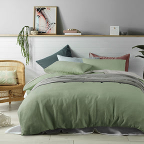 Rochecorbon sage linen quilt cover set in a solid tone on a styled bed