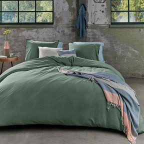 Blois green organic cotton quilt cover set king size on a styled bed