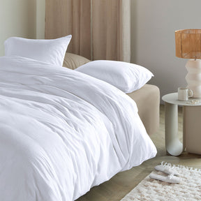 Saumur white seersucker cotton quilt cover set with crinkled texture on a bed