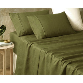 Pienza fern green pure hemp sheet set on a natural bedroom bed