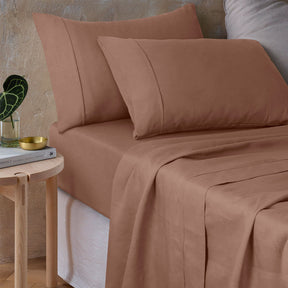 Pienza hazelnut pure hemp sheet set on an earthy bedroom bed