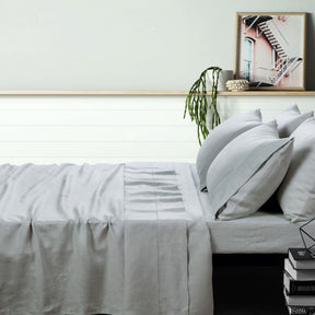 Montepulciano dove grey pure linen sheet set on a styled bed