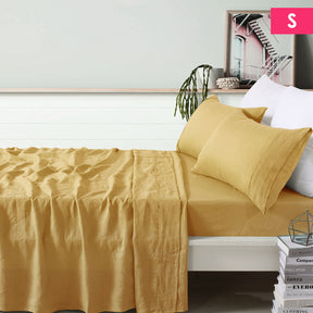 Montepulciano ochre pure linen sheet set on a single bed in a natural bedroom