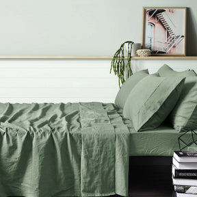 Montepulciano sage pure linen sheet set on a botanical bedroom bed