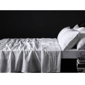 Montepulciano white pure linen sheet set on a bright bed